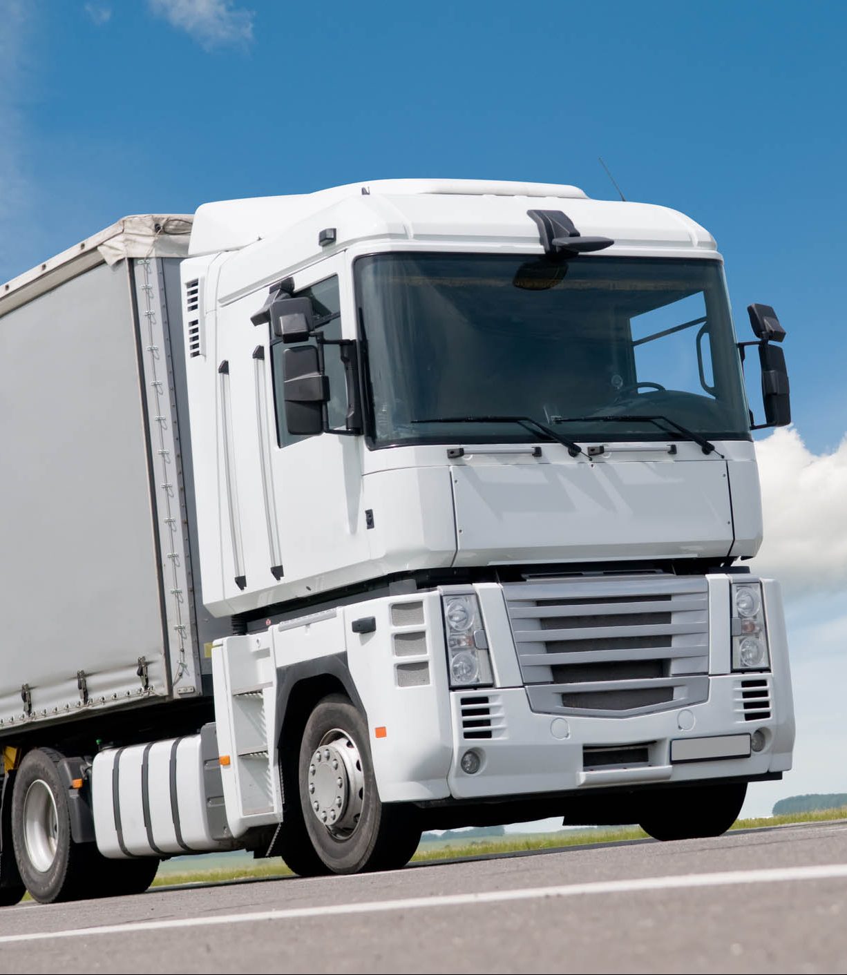 close up white truck on road